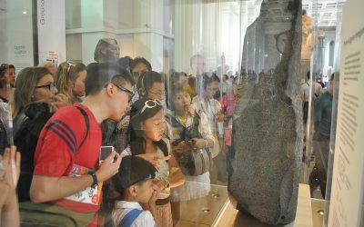 Tourists visit the Rosetta Stone