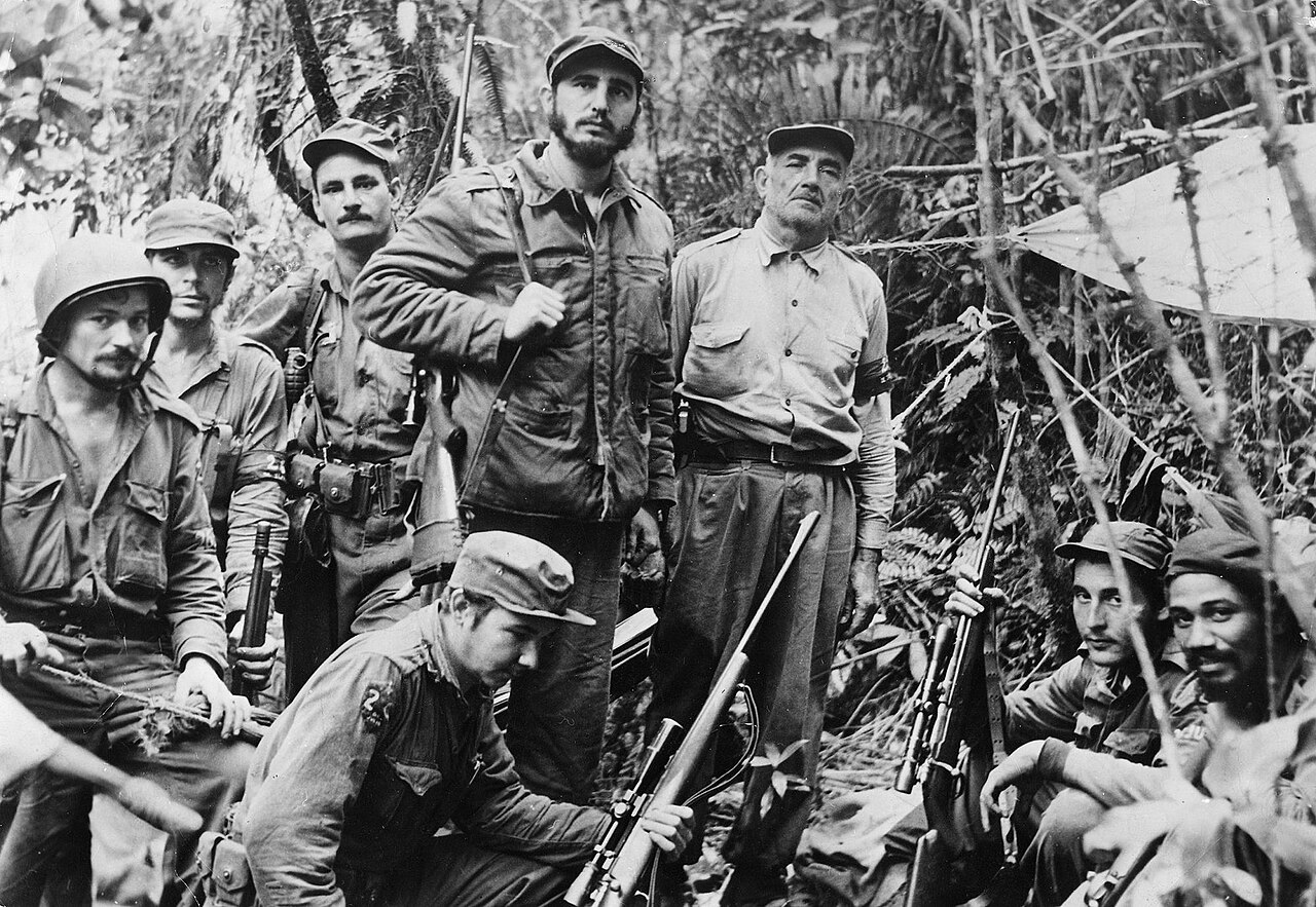 Granma survivors in the Sierra Maestra. Fidel Castro stands at center. Che Guevara stands second from left.