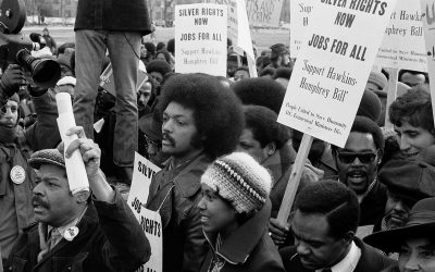 More details Jesse Jackson surrounded by marchers carrying signs advocating support for the Hawkins-Humphrey Bill for full employment,