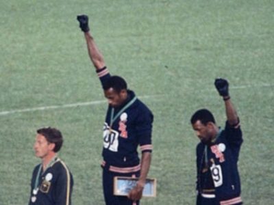 Smith and Carlos doing the Black power salute at the 1968 olympics
