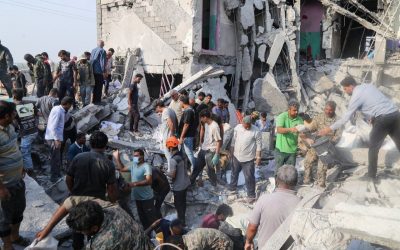 Rescuers and residents searching the rubble of the destroyed Shajareh Tayyebeh elementary school in Minab