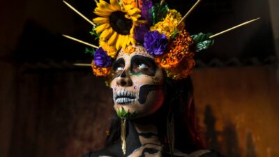 woman in traditional dia de los muertos makeup