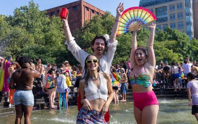 people in the park celebrating pride month