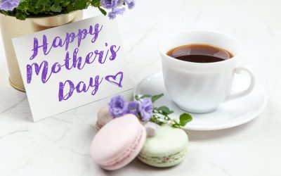 white ceramic teacup and mother's day card