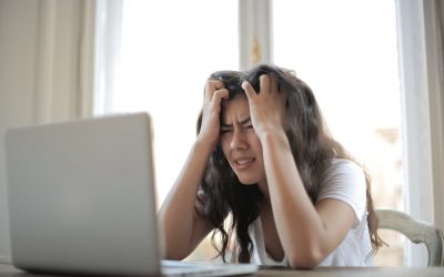 woman in white shirt showing frustration