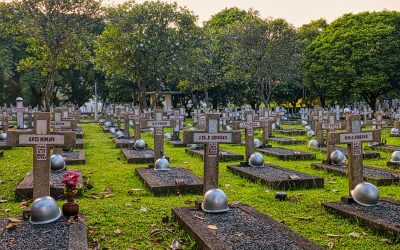 gravestones with crosses on cemetery