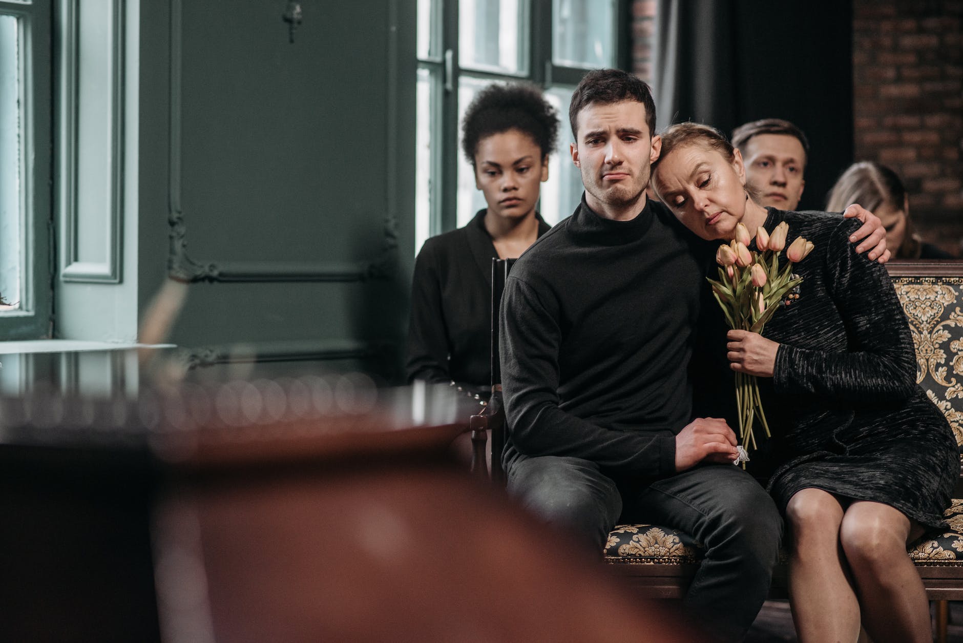 man and woman sitting on the chair