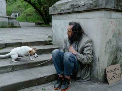 a homeless man with a dog