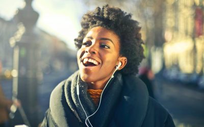 close up photo of a woman listening to music