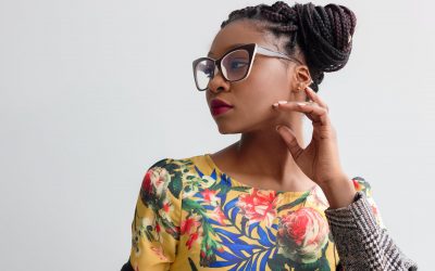 photo of woman wearing yellow floral top