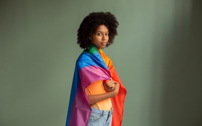 rainbow flag wrapped around woman